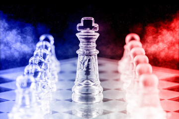 Glass chess pieces on a glass chessboard