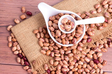 Natural bean grains
Phaseolus vulgaris on dark grain wood background