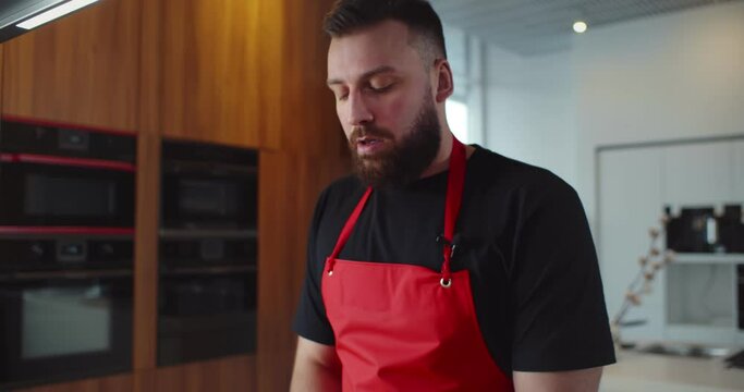 Professional man chef keeping daily blog and telling followers how to cook heathy food