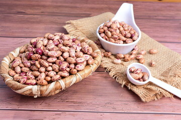Natural bean grains
Phaseolus vulgaris on dark grain wood background