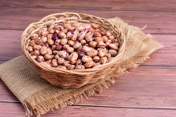 Natural bean grains
Phaseolus vulgaris on dark grain wood background