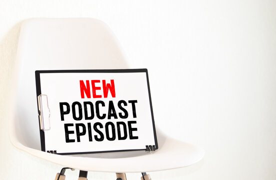 Top View Of Podcast Recording Equipment On Desk With Words New Podcast Episode Written On Note Pad.