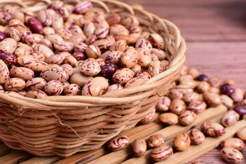 Natural bean grains
Phaseolus vulgaris on dark grain wood background
