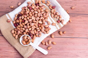 Natural bean grains
Phaseolus vulgaris on dark grain wood background