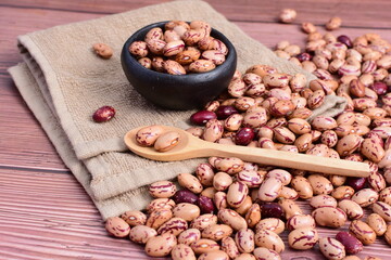 Natural bean grains
Phaseolus vulgaris on dark grain wood background