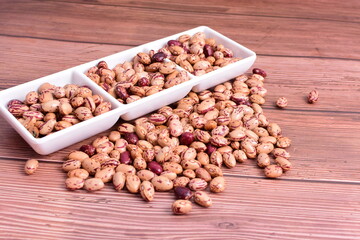 Natural bean grains
Phaseolus vulgaris on dark grain wood background