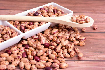 Natural bean grains
Phaseolus vulgaris on dark grain wood background