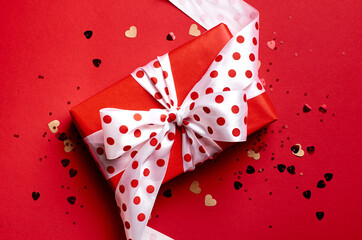 Valentines day gift box on red paper background