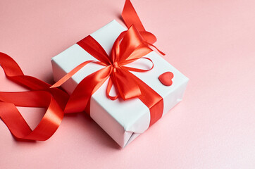 Valentines day gift box with heart on pink background