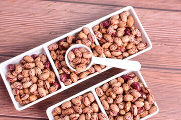 Natural bean grains
Phaseolus vulgaris on dark grain wood background