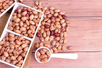 Natural bean grains
Phaseolus vulgaris on dark grain wood background