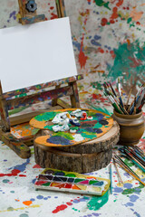 Brushes and paints for painting on an old background.