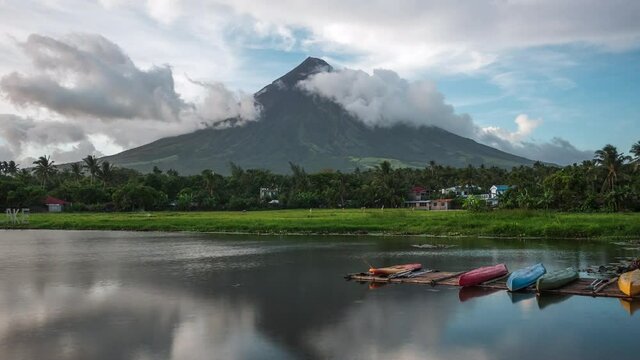 Legazpi, Albay, Philippines, zoom out time lapse view of Mount Mayon Volcano and Sumlang Lake at sunset.