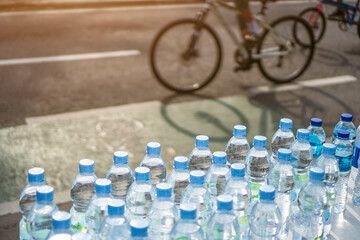 Drinking water stand with cyclists beside it at car-free day events during the pandemic. healthy lifestyle 