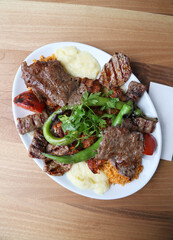 Mixed kebab with bulgur pilaf and mashed potato