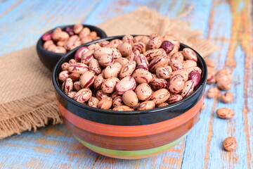 
Natural bean grains
Phaseolus vulgaris on blue grain wood background
