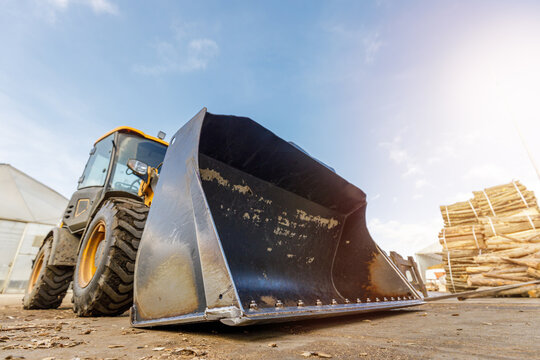 Low angle shoot of a small tractor or escavator. Industrial concept.