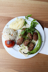 Meatballs with pistachio with rice and mashed potato