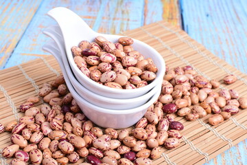 
Natural bean grains
Phaseolus vulgaris on blue grain wood background