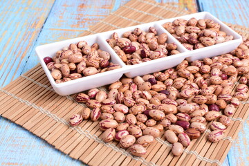 
Natural bean grains
Phaseolus vulgaris on blue grain wood background