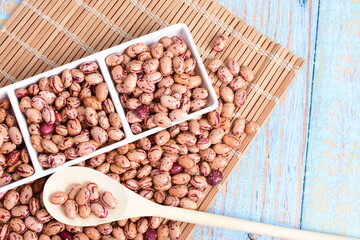 
Natural bean grains
Phaseolus vulgaris on blue grain wood background