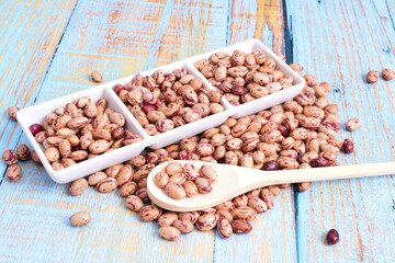 
Natural bean grains
Phaseolus vulgaris on blue grain wood background