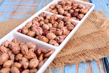 
Natural bean grains
Phaseolus vulgaris on blue grain wood background
