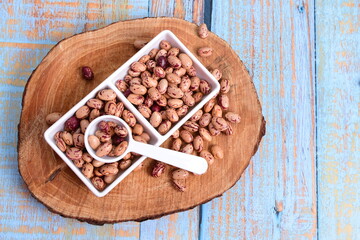 
Natural bean grains
Phaseolus vulgaris on blue grain wood background