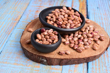 
Natural bean grains
Phaseolus vulgaris on blue grain wood background