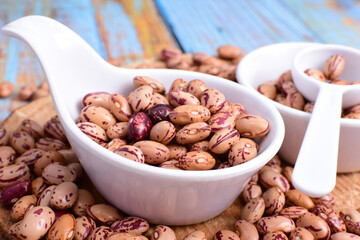 
Natural bean grains
Phaseolus vulgaris on blue grain wood background