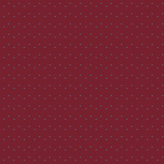 Seamless pattern of small triangles floating on a rusty red background