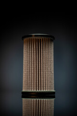 CAR FILTER as car part placed on white reflexive glass on white background 