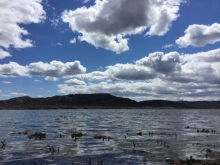 clouds over the lake in Madrid mountains