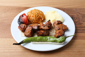 Shish kebab with bulgur pilaf and mashed potato
