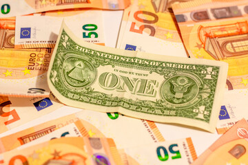 Fifty euro money banknotes background texture and one usd american dollar in close up