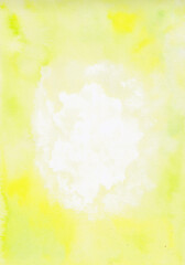 Abstract light yellow watercolor background on paper. The circle frame.