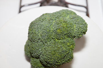 Uncut Broccoli Sitting on a Stove