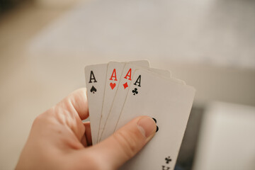 Closeup shot of hands holding playing cards