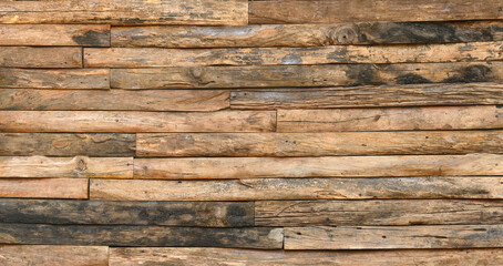 background of finishing wall made from wood slab on vintage house style.