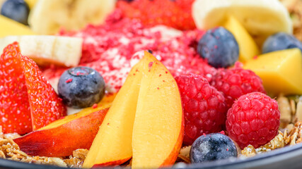 A healthy bowl of muesli and fruit for a colorful fresh breakfast