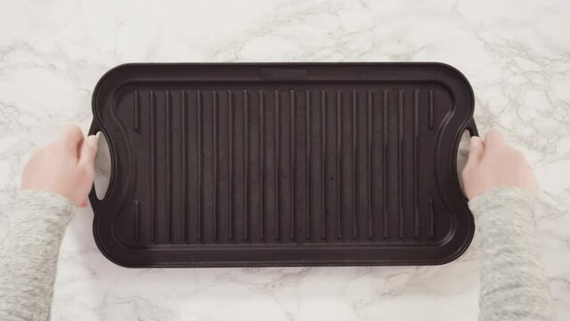 Flat Lay. Cast Iron Griddle On A Marble Background.