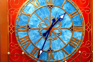 Wall clock in a mall displayed outdoors.