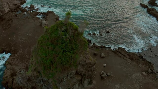 Beautiful volcanic rock beach aerial footage in Java Island, Indonesia.