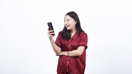 woman wearing pajama hold phone smilling isolated white background