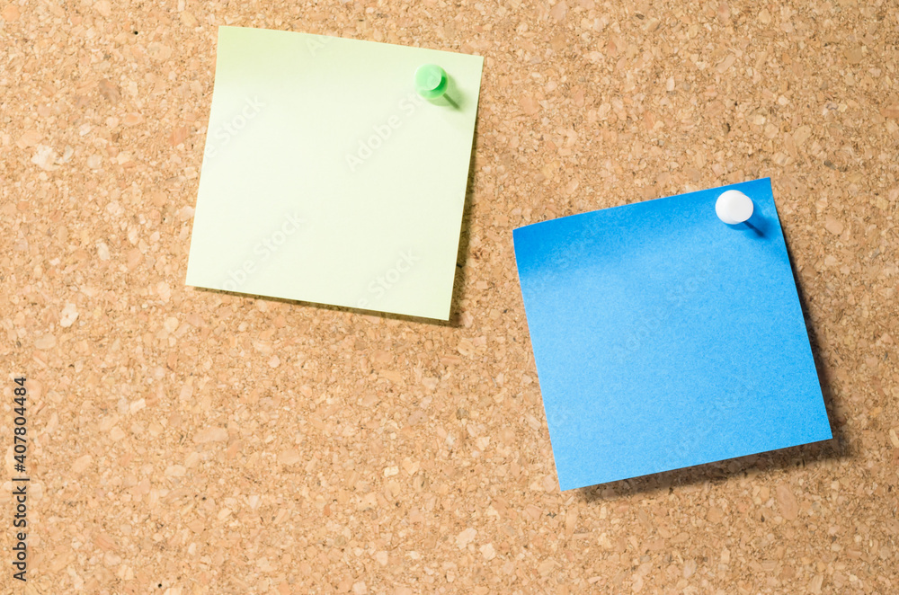 Poster view of two blank post-it notes on a corkboard with copy space