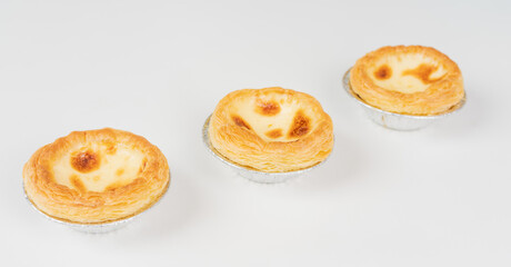 Baked egg tart on white background