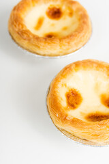 Baked egg tart on white background