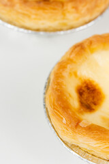 Baked egg tart on white background