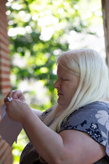 Woman Opening Mail