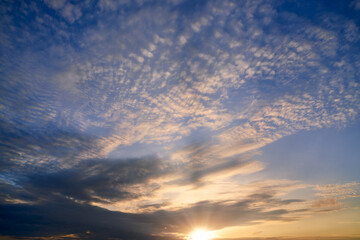 Fototapeta na wymiar Sunrise skyline with blue sky and sun rays pass from cloud